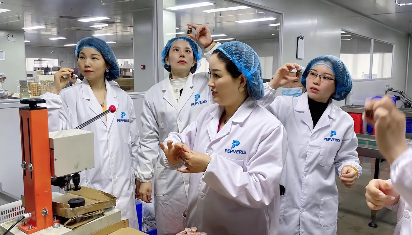 Staff reviewing a peptide sample